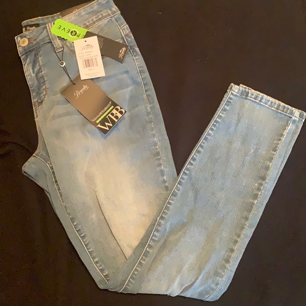 Blue jeans with rips near knee (made with them). With tags. Never worn